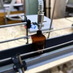 Conveyorized Automatic Liquid Filling Machine