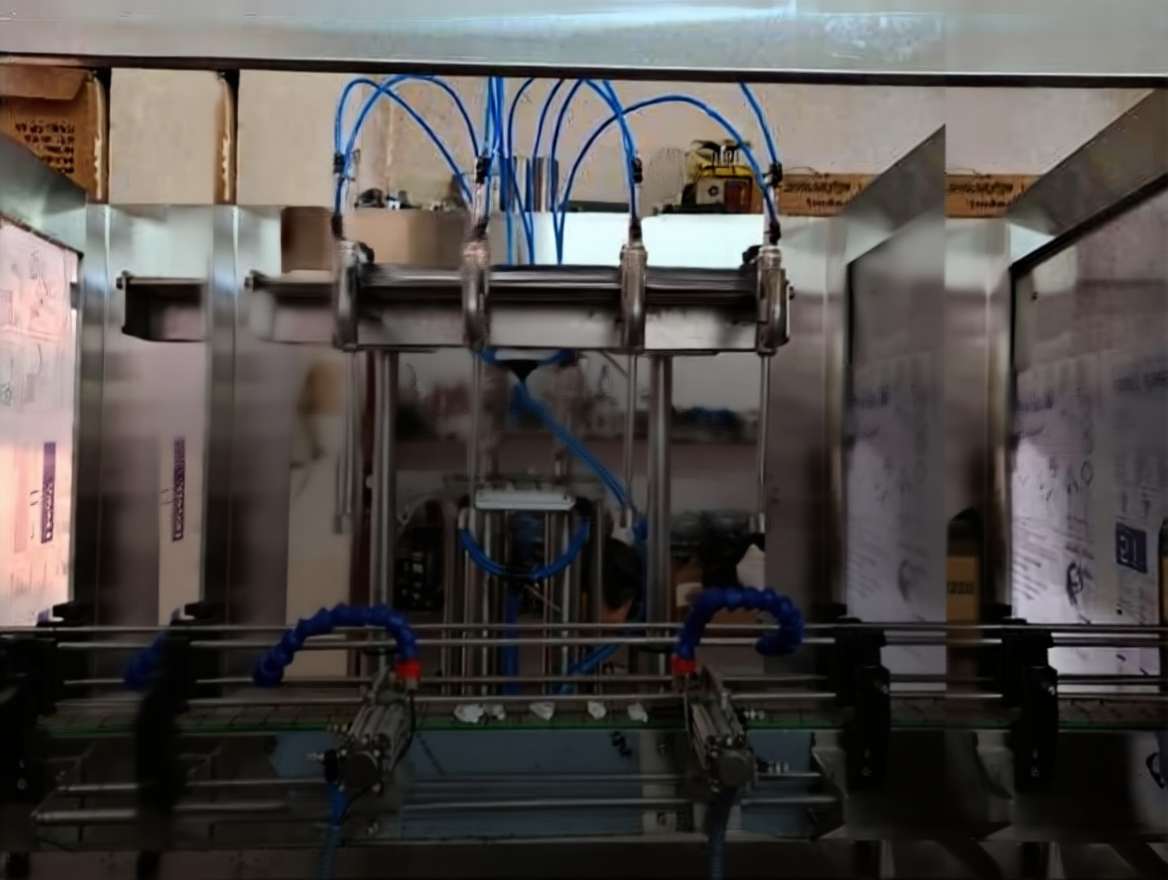 fytkdnwjrsrma0ctnptrspyfx8 4-Nozzle Automatic Liquid Filling Machine - Image 1